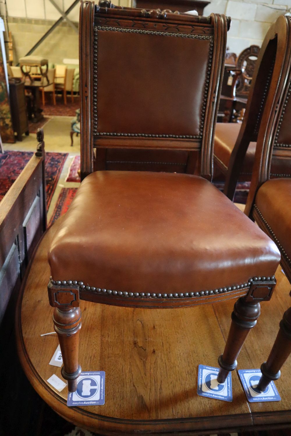 A late 19th century Continental walnut extending dining table, width 140cm, depth 124cm (no leaves) and four chairs